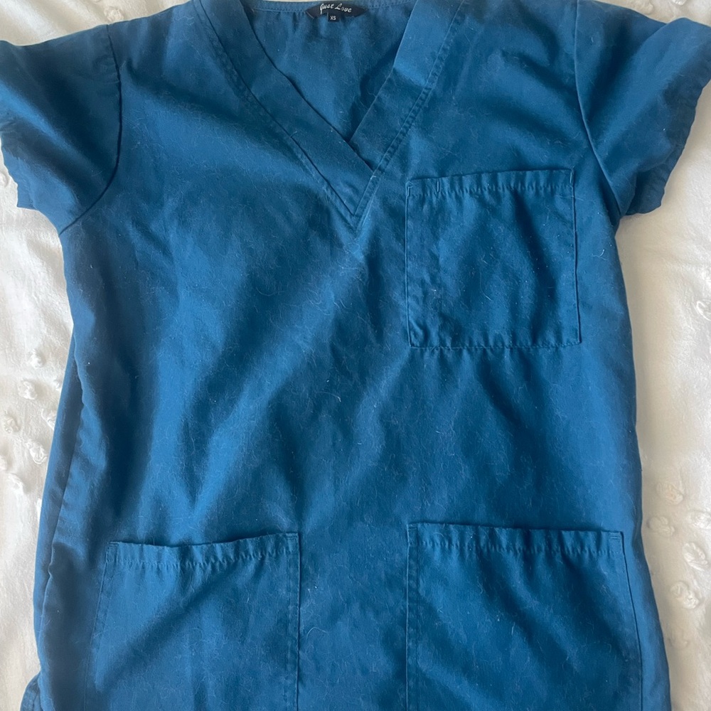 2 pairs of scrubs in excellent condition